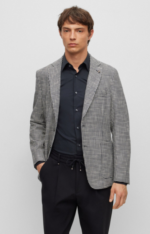 Jas blazer dengan motif houndstooth